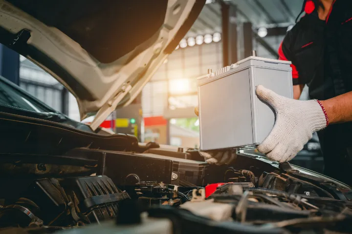 A mechanic checking how long the battery will last.
